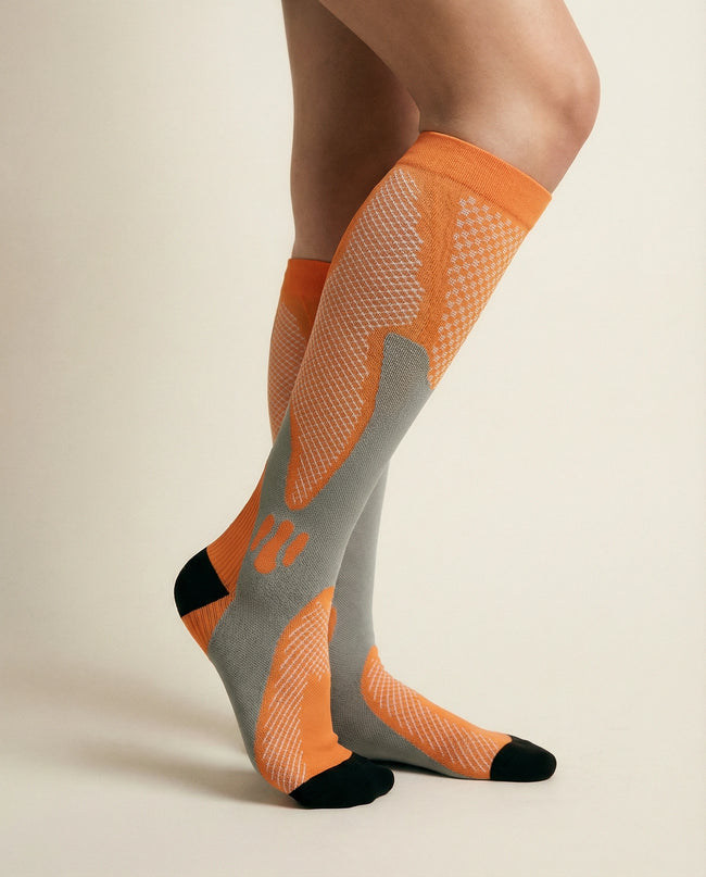 Orange and gray knee-high socks on a beige background