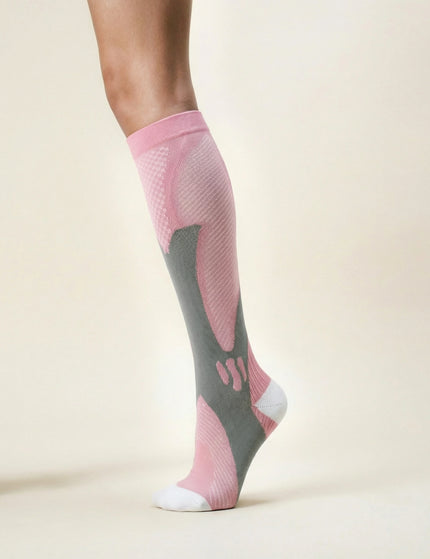 Pink and gray compression sock on a beige background