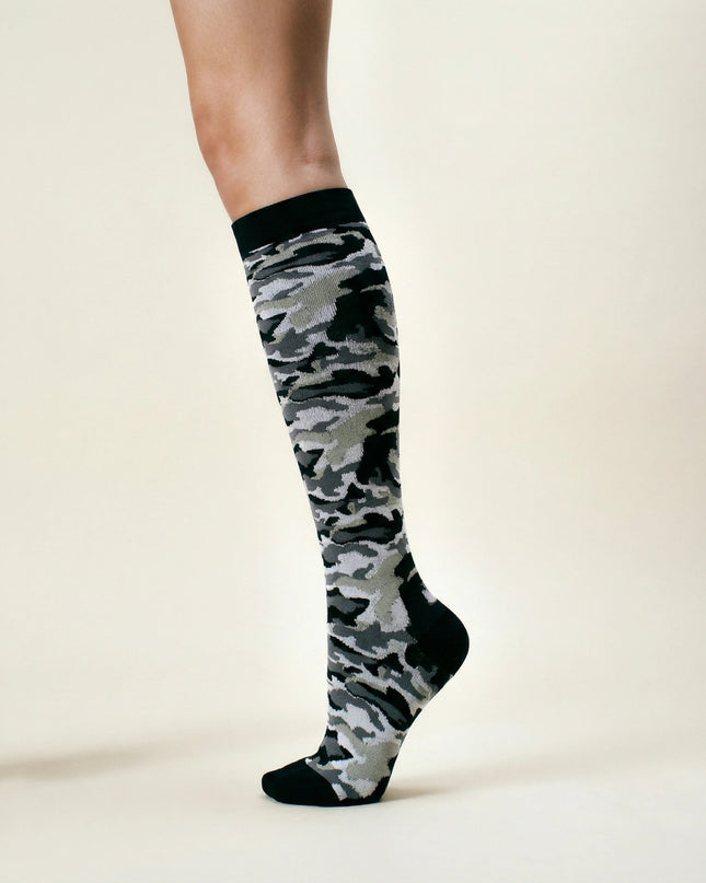 Camouflage knee-high sock on a white background