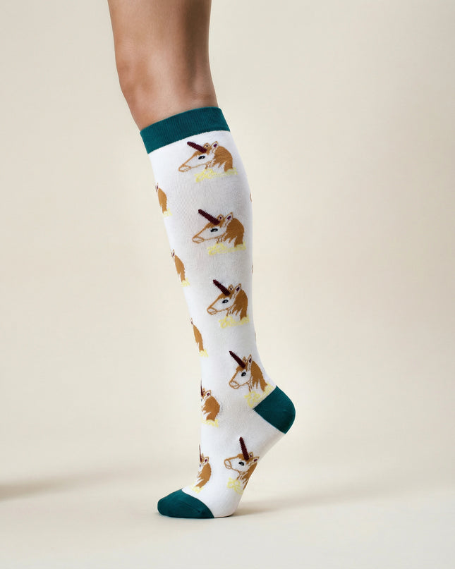 Knee-high socks with dog pattern worn by a person on a beige background