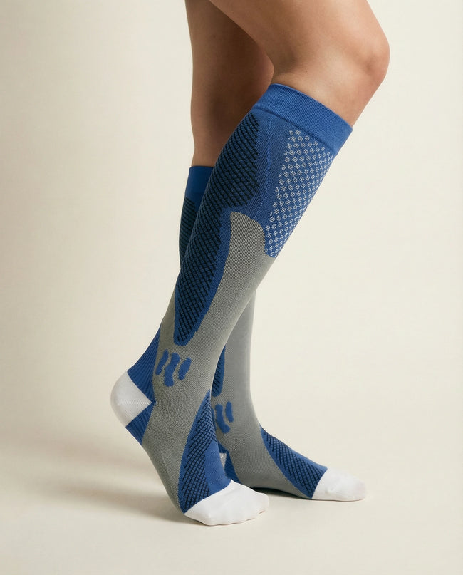 Blue and gray knee-high socks on a beige background