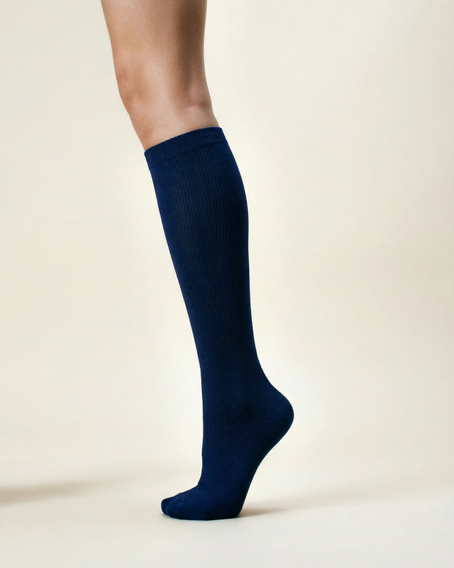 Navy knee-high sock on a beige background