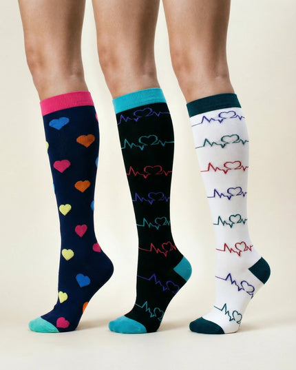 Three pairs of knee-high socks with heart and heartbeat pattern on a beige background