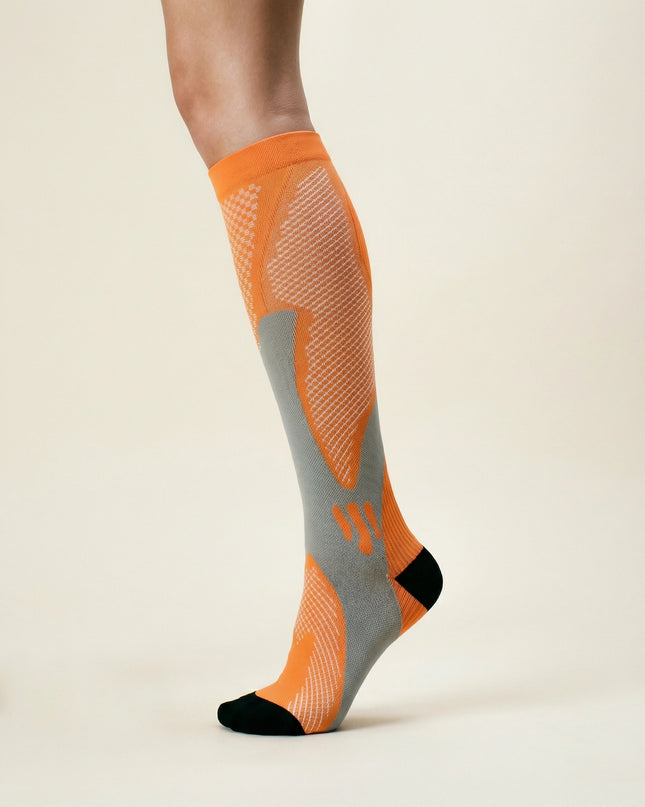 Orange and gray sock on a beige background